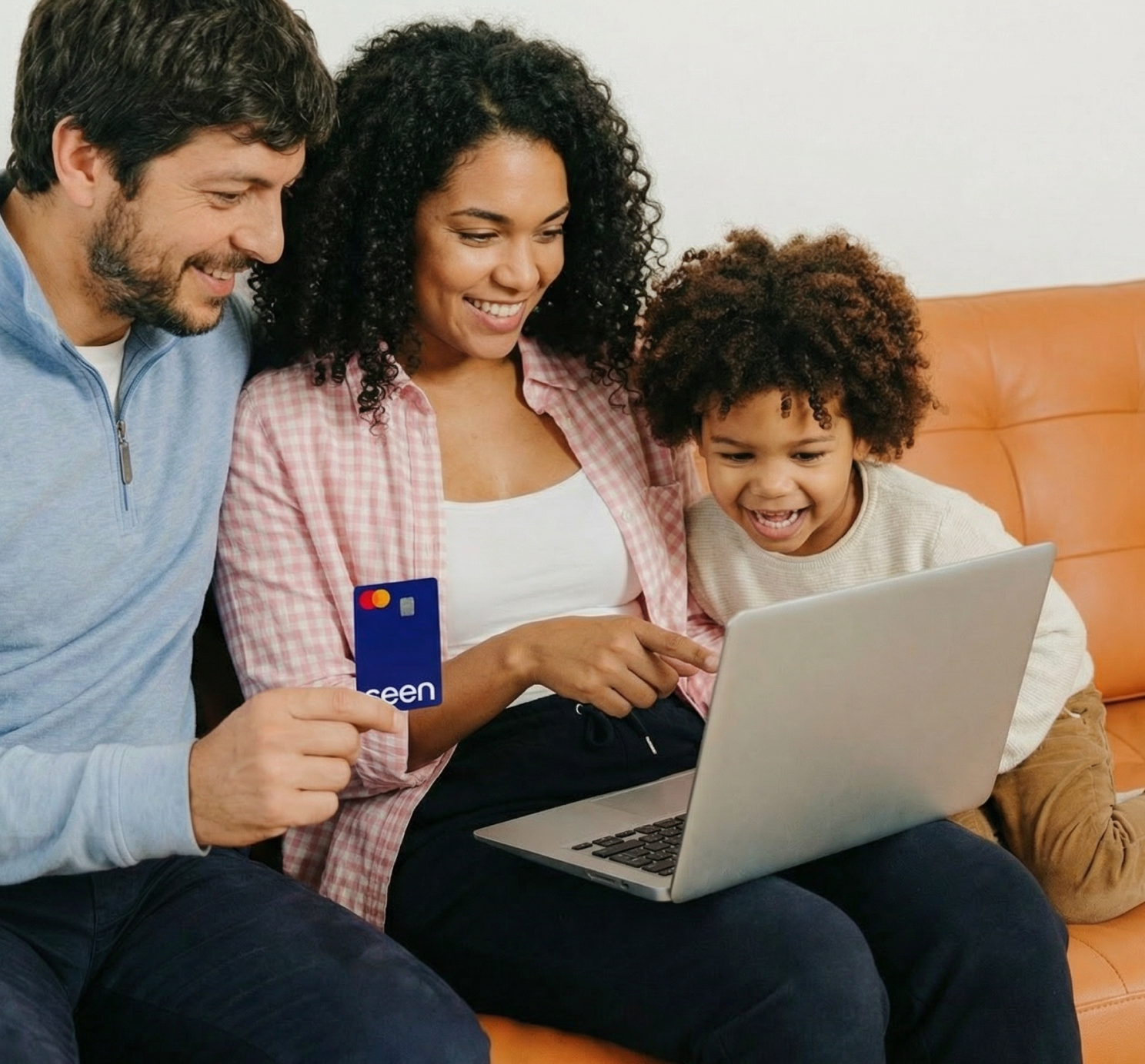 Person smiling while using a Seen credit card